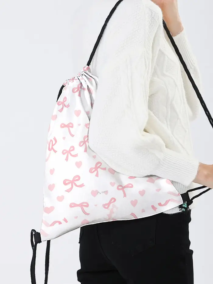 Sac à dos rose à cordon de serrage avec imprimé nœud et cœur