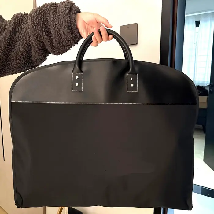 Sac à vêtements de transport en cuir pour voyage, étanche à la poussière, pliable, sac de rangement 