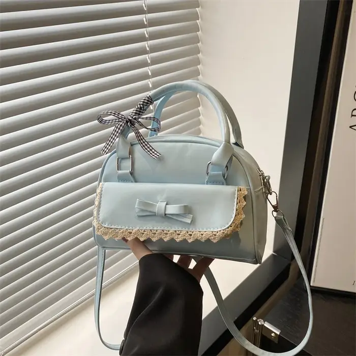 Un sac Boston polyvalent à main avec nœud papillon pour femmes en version coréenne 2025, un sac à ba