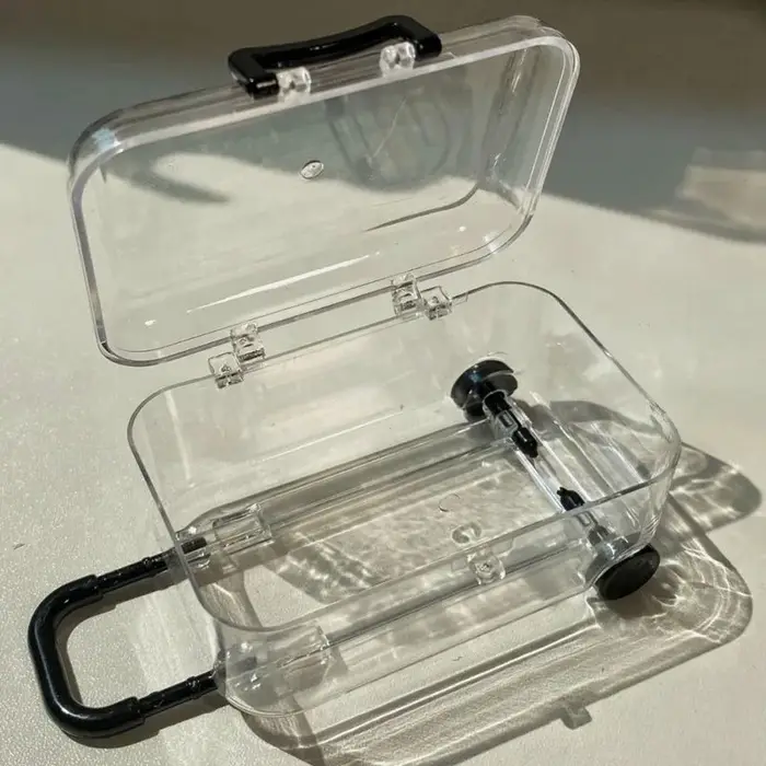 Mini valise à ornement lumineux avec roues rétractables